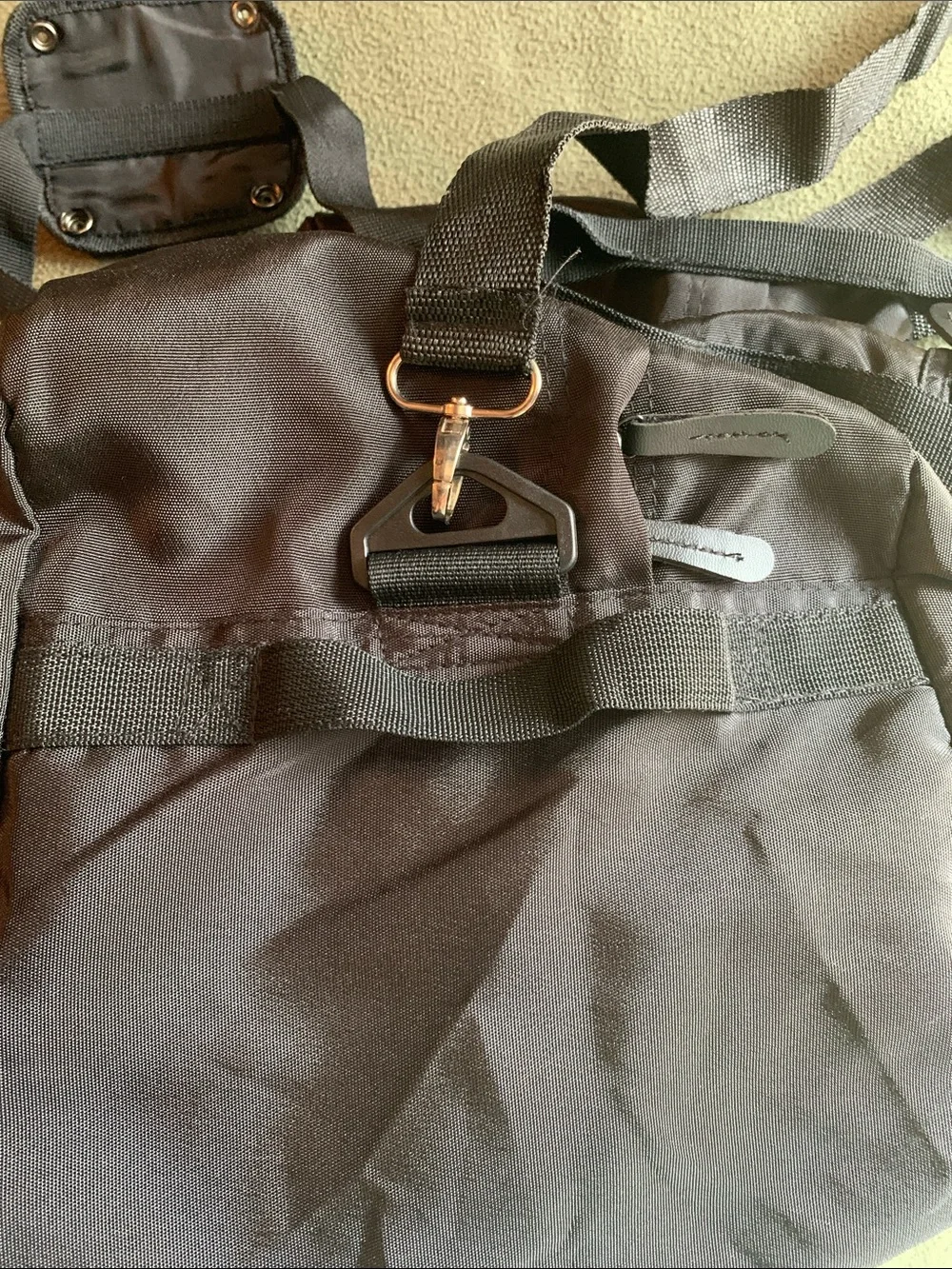 EUC black nylon duffel bag with strap. Approximately 22” x 14” x 10.5”